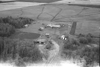 Aerial photograph of a farm near Revenue, SK (37-21-W3)
