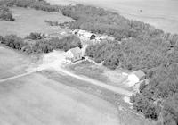 Aerial photograph of a farm near Cutknife, SK (44-22-W3)