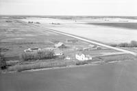 Aerial photograph of a farm near Four Corners, SK (60-1B-W3)