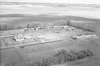 Aerial photograph of a farm near Tramping Lake, SK (36-22-W3)