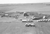 Aerial photograph of a farm near Kerrobert, SK (34-21-W3)