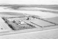 Aerial photograph of a farm in Saskatchewan (48-28-W3)