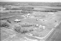 Aerial photograph of a farm near Marcelin, SK (45-7-W3)