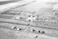 Aerial photograph of a farm near Blaine Lake, SK (45-7-W3)