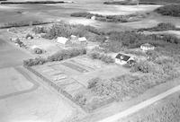 Aerial photograph of a farm near Marcelin, SK (45-7-W3)