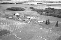 Aerial photograph of a farm near Marcelin, SK (45-7-W3)