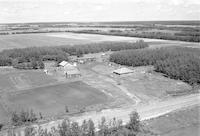 Aerial photograph of a farm near Mervin, SK (49-19-W3)