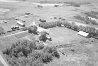 Aerial photograph of a farm near Turtleford, SK (51-20-W3)