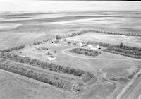 Aerial photograph of a farm near Blaine Lake, SK (10-44-7-W3)
