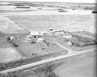 Aerial photograph of a farm near S. Makwa, SK (58-20-W3)