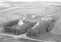 Aerial photograph of a farm near Marcelin, SK (45-7-W3)