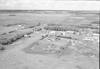 Aerial photograph of a farm near Meadow Lake, SK (60-17-W3)