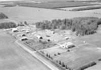 Aerial photograph of a farm near Borden, SK (40-3-W3)