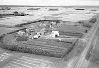 Aerial photograph of a farm near Borden, SK (40-9-W3)
