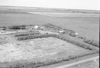 Aerial photograph of a farm near Blaine Lake, SK (45-7-W3)