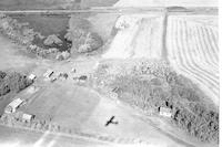 Aerial photograph of a farm near Richard, SK (43-13-W3)