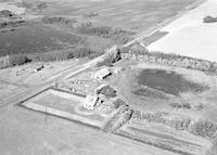 Aerial photograph of a farm near Richard, SK (43-13-W3)