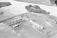 Aerial photograph of a farm near Richard, SK (43-13-W3)