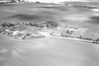 Aerial photograph of a farm in Saskatchewan (30-44-15-W3)