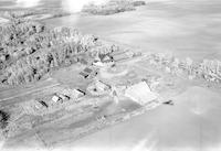 Aerial photograph of a farm near Meota, SK (46-18-W3)