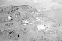 Aerial photograph of a farm near Paynton, SK (47-21-W3)