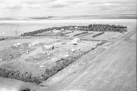 Aerial photograph of a farm near Kerrobert, SK (34-20-W3)