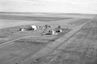 Aerial photograph of a farm near Kerrobert, SK (34-21-W3)