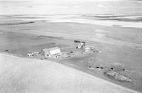 Aerial photograph of a farm near Kerrobert, SK (34-21-W3)