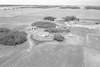 Aerial photograph of a farm in Saskatchewan (48-24-W3)