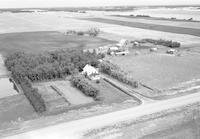 Aerial photograph of a farm in Saskatchewan (48-24-W3)