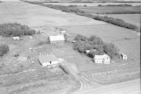 Aerial photograph of a farm in Saskatchewan (48-24-W3)