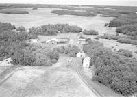 Aerial photograph of a farm in Saskatchewan (48-24-W3)