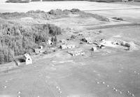 Aerial photograph of a farm in Saskatchewan (49-2-W3)