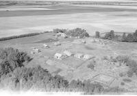 Aerial photograph of a farm in Saskatchewan (49-2-W3)