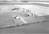 Aerial photograph of a farm in Saskatchewan (49-2-W3)