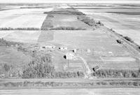 Aerial photograph of a farm in Saskatchewan (49-2-W3)