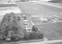 Aerial photograph of a farm in Saskatchewan (49-3-W3)