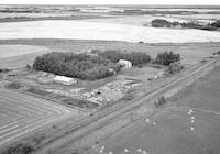 Aerial photograph of a farm in Saskatchewan (49-3-W3)