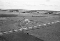 Aerial photograph of a farm in Saskatchewan (49-3-W3)