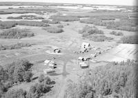 Aerial photograph of a farm in Saskatchewan (34-49-19-W3)