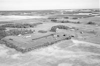 Aerial photograph of a farm near Mervin, SK (49-19-W3)