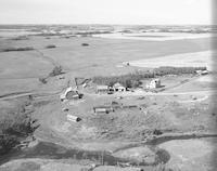 Aerial photograph of a farm in Saskatchewan (49-20-W3)