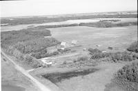 Aerial photograph of a farm in Saskatchewan (49-20-W3)