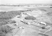 Aerial photograph of a farm in Saskatchewan (49-23-W3)