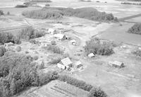 Aerial photograph of a farm in Saskatchewan (49-23-W3)