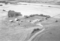 Aerial photograph of a farm in Saskatchewan (49-23-W3)