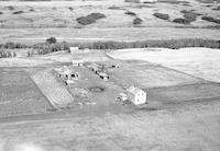 Aerial photograph of a farm in Saskatchewan (49-23-W3)