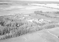 Aerial photograph of a farm near Turtleford, SK (51-20-W3)