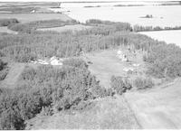 Aerial photograph of a farm near Paradise Hill, SK (52-23-W3)