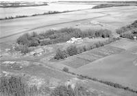 Aerial photograph of a farm near Paradise Hill, SK (52-23-W3)